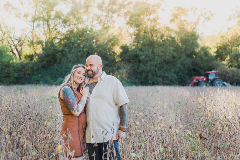 couple in field laughing