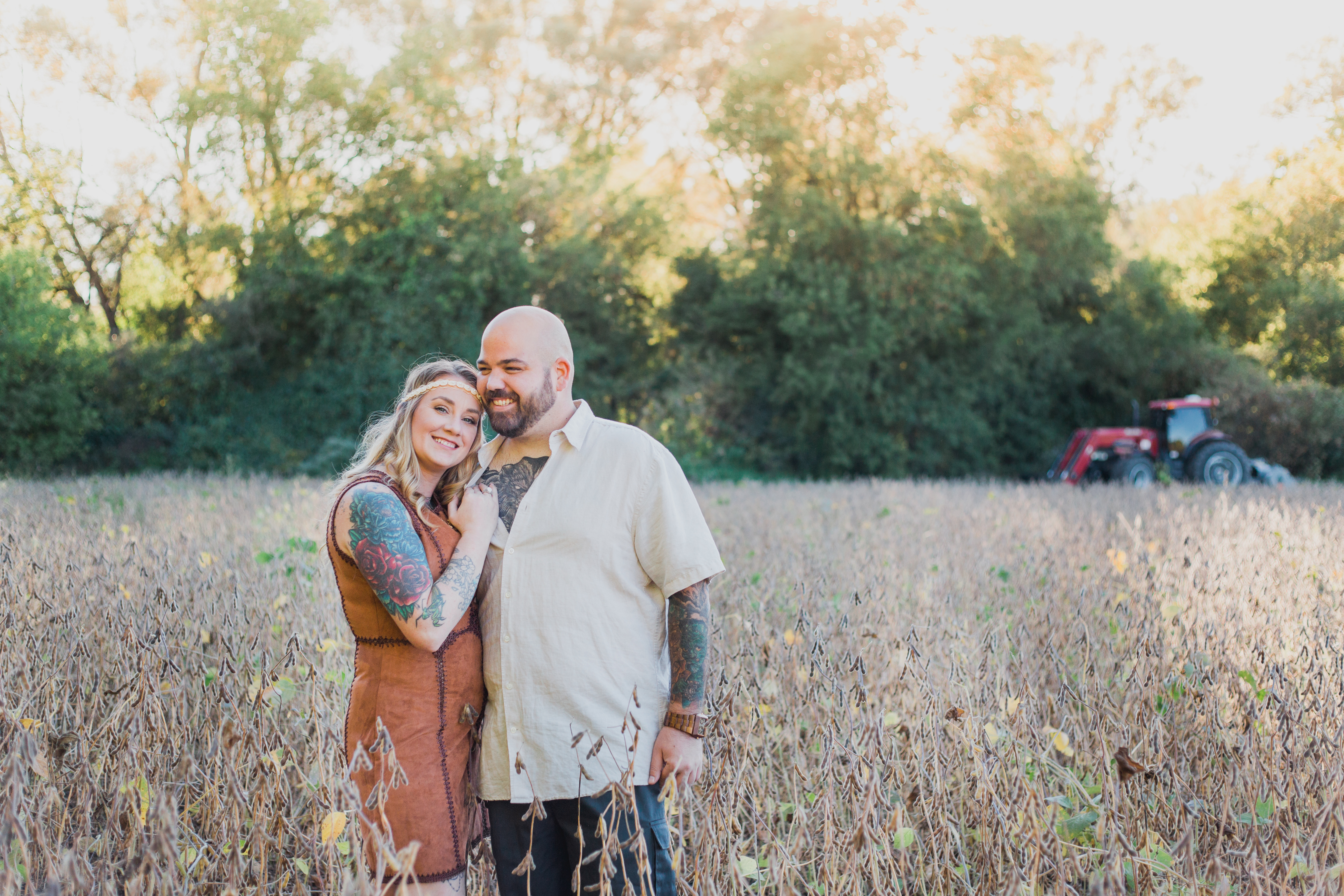couple in field laughing